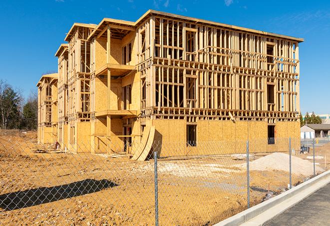 a panoramic view of temporary chain link fences on a construction site, separating work zones in Costa Mesa, CA